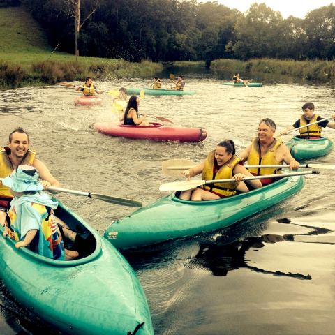 a group of people on a boat in the water
