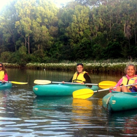 a person riding on the back of a boat in the water