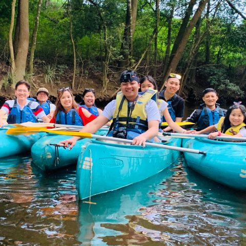 Zack Lee et al. riding on the back of a boat