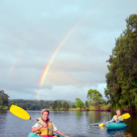a rainbow over a body of water